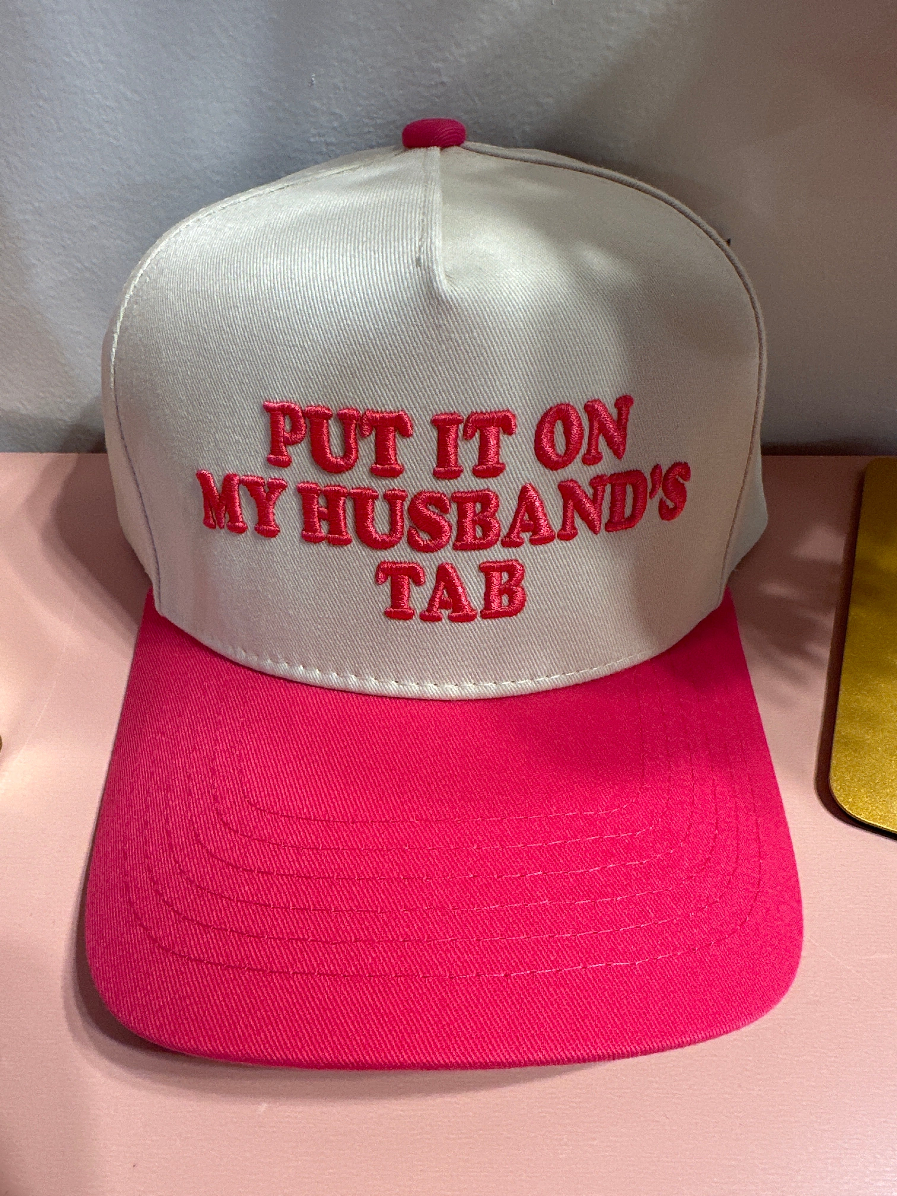 The Husband’s Tab Trucker Hat