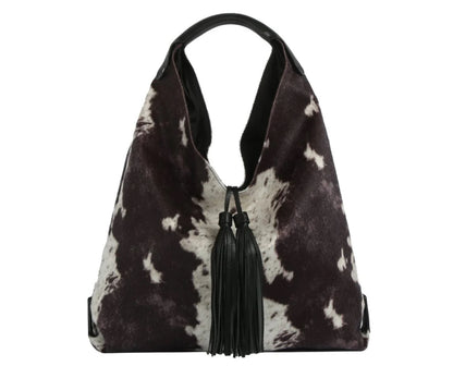 The Faux Suede Cow Print Hobo Tote Bag With Tassels