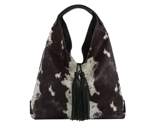 The Faux Suede Cow Print Hobo Tote Bag With Tassels