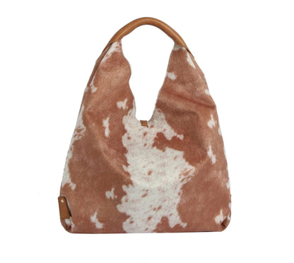 The Faux Suede Cow Print Hobo Tote Bag With Tassels